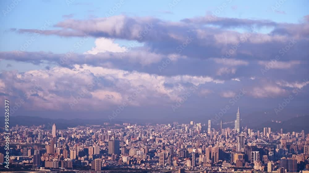 A breathtaking panoramic view of a bustling city at sunset. Soft, fluffy clouds drift across the sky, casting a warm glow over the urban landscape. Captured in Dading Mountain, Shulin, Taiwan. A breathtaking panoramic view of a bustling city at sunset. Soft, fluffy clouds drift across the sky, casting a warm glow over the urban landscape. Captured in Dading Mountain, Shulin, Taiwan.