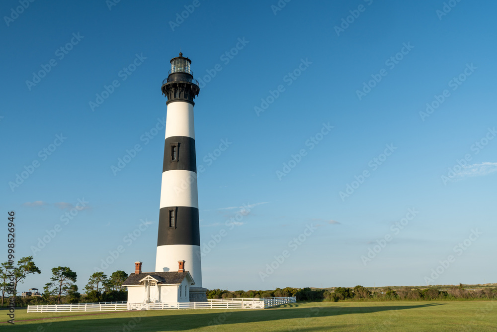 Bodie Island Lighthouse at dusk golden hour, Outer Banks, North Carolina.