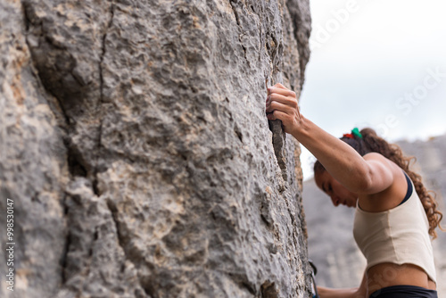 A strong woman rock climbing