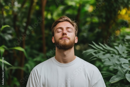 Cultivating Inner Peace: A Man Practicing Mindfulness Meditation in Lush Green Surroundings