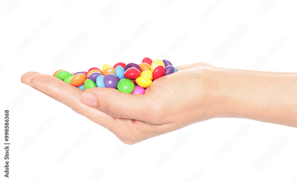 Woman hand holds lot of color candies, isolated on transparent background, fast food concept Woman hand holds lot of color candies, isolated on transparent background, fast food concept