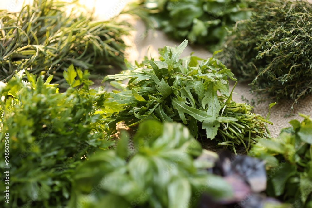 Different fresh herbs on table, closeup view Different fresh herbs on table, closeup view