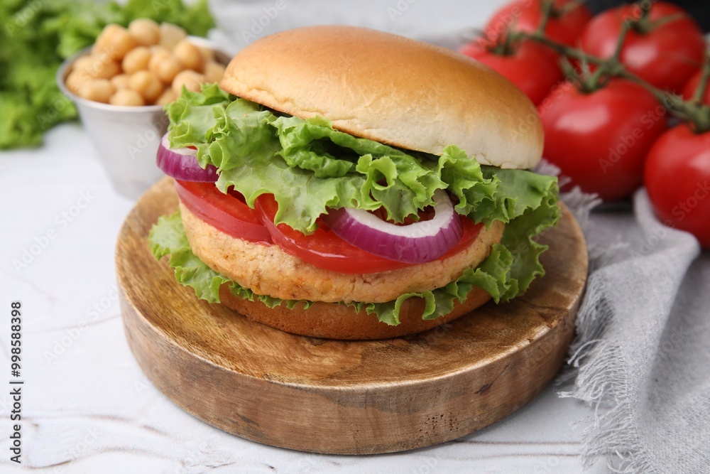 Delicious vegetarian burger with chickpea cutlet on white table, closeup Delicious vegetarian burger with chickpea cutlet on white table, closeup