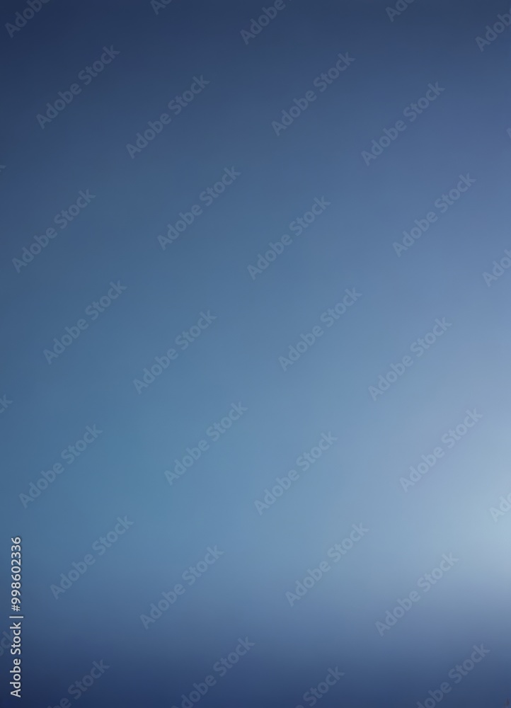 Obraz premium a gradient of blue hues, transitioning from a deep blue at the top to a lighter shade at the bottom The gradient appears to be smooth and continuous, with no discernible