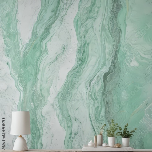 a marble-like wall with a green and white swirl pattern, a white lamp, and a small table with a plant and other items