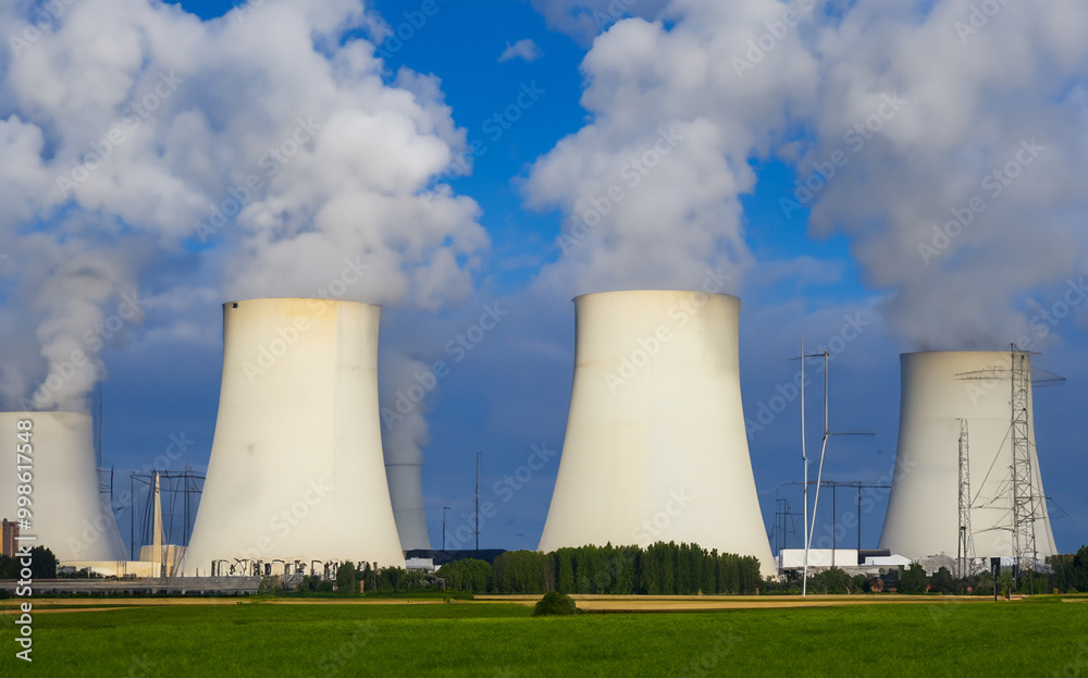 Nuclear power plant on green grass field generated with AI Nuclear power plant on green grass field generated with AI