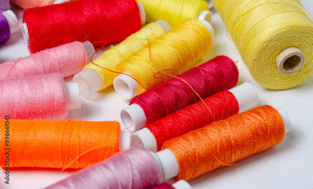 Top view of many colorful thread spools background Top view of many colorful thread spools background