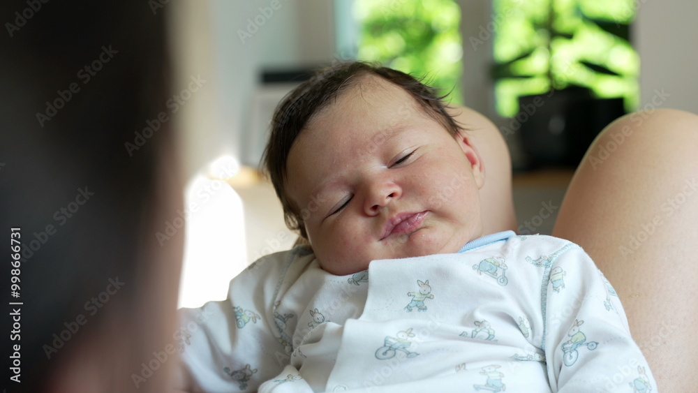 Close-up of a baby resting on a parent's lap, gazing up with curiosity and wonder, dressed in a cute onesie, highlighting the innocence and charm of early childhood Close-up of a baby resting on a parent's lap, gazing up with curiosity and wonder, dressed in a cute onesie, highlighting the innocence and charm of early childhood