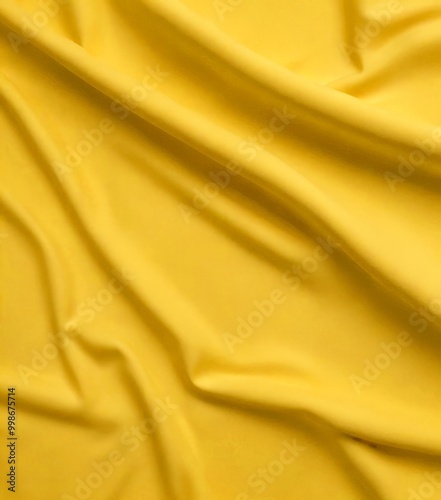 a close-up view crumpled yellow fabric, with the folds and creases clearly visible