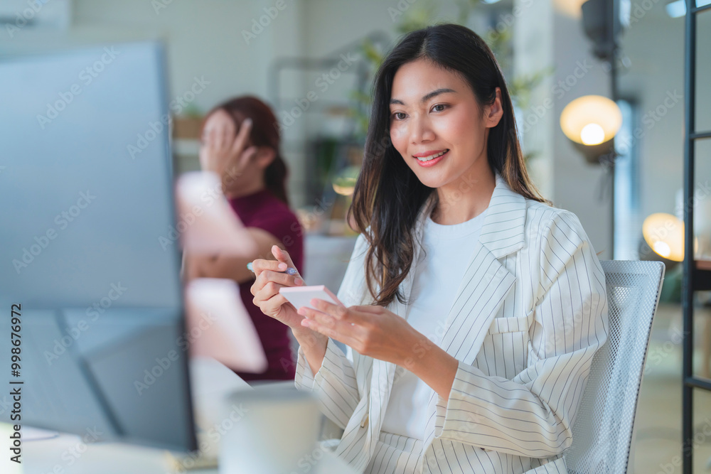casual relax working in office smiling peaceful asian business woman chill cosy after finish project work while sit at working desk office interior design background business routine workspace