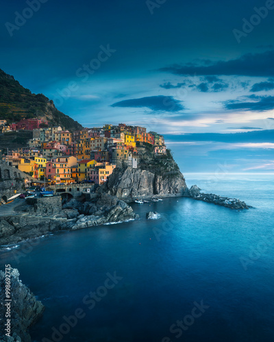 Fototapeta Naklejka Na Ścianę i Meble -  Manarola village, rocks and sea in blue hour. Cinque Terre, Italy.