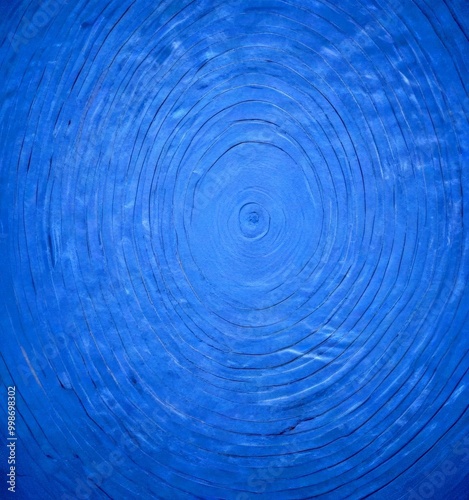 a close-up view blue surface with concentric circles of varying sizes, creating a visually striking pattern photo