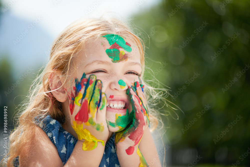 Girl, child and paint on face outdoor at school for creative learning, art assignment and education fun in nature. Student, kid and happy with colorful mess for craft, artwork and playing at academy Girl, child and paint on face outdoor at school for creative learning, art assignment and education fun in nature. Student, kid and happy with colorful mess for craft, artwork and playing at academy