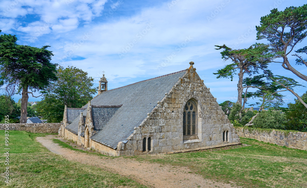 ancient romanesque chapel in Port Blanc at the rose granite coast of Brittany, France ancient romanesque chapel in Port Blanc at the rose granite coast of Brittany, France
