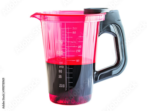 a red and black liquid in a measuring cup photo