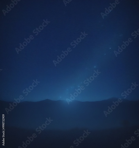 a serene night sky with a starry expanse and a glowing horizon line, suggesting a calm and peaceful atmosphere photo