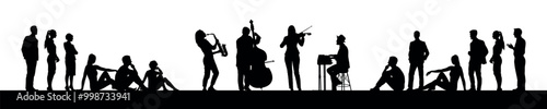 Musicians giving outdoor music performance with people crowd audience black silhouettes.