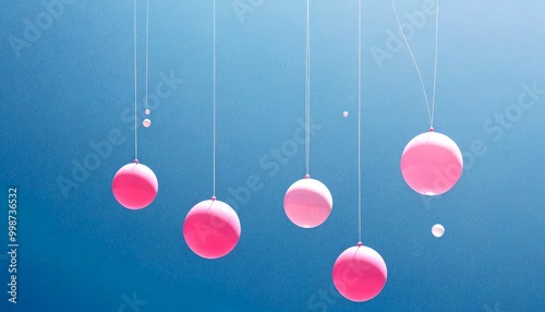 Pink and white balloons float against a deep blue sky, creating a whimsical and dreamlike scene