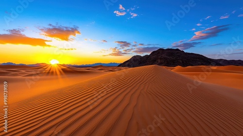 A serene desert landscape with sand dunes illuminated by the soft golden light of sunset