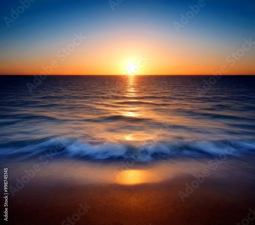 A blurred serene sunset over the ocean, with the sun's reflection on the water's surface and a gentle wave breaking on the sandy beach