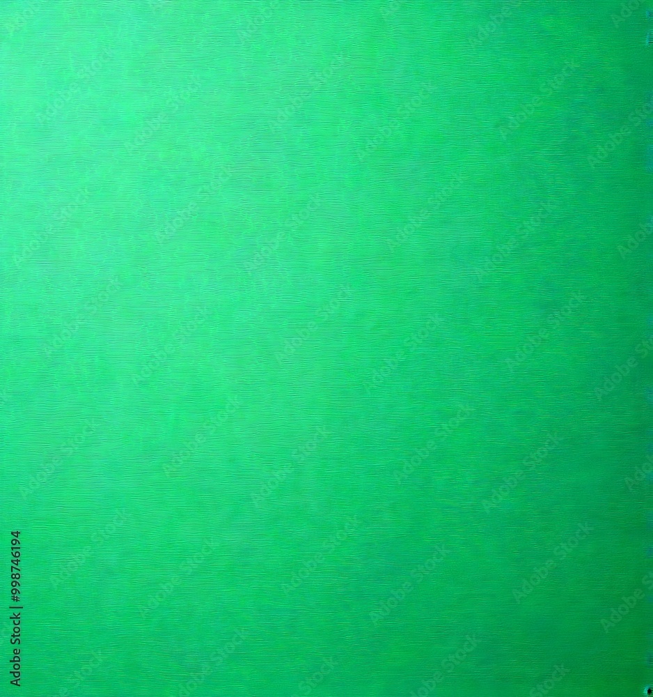 a close-up view of a vibrant green surface, which appears to be a piece of paper or a similar material. The color is vivid and uniform, suggesting a a close-up view of a vibrant green surface, which appears to be a piece of paper or a similar material. The color is vivid and uniform, suggesting a
