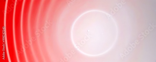 a gradient background transitioning from red to white, with a central white circle and a small white dot in the center photo