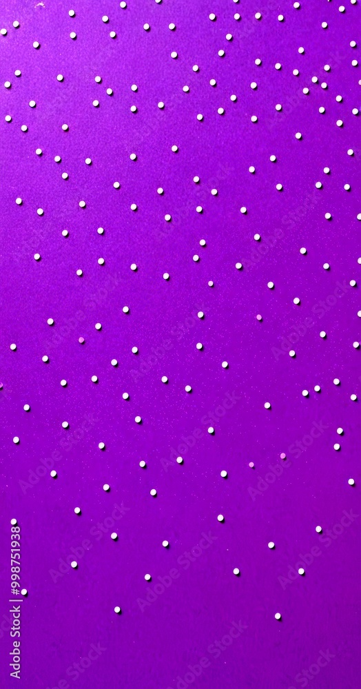 A close-up view purple background with white dots scattered randomly, creating a sense of movement and depth
