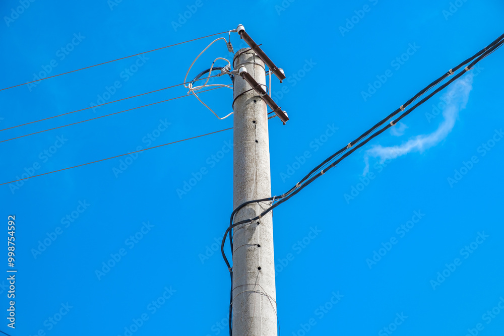 electric pole with lines and wires against blue sky. electric pole with lines and wires against blue sky.