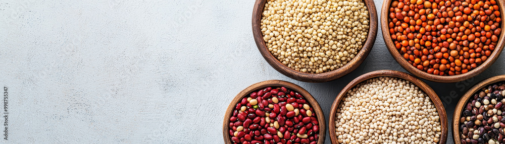 Rustic bowls filled with variety of mixed grains and legumes create vibrant and healthy display, showcasing natures bounty in appealing arrangement Rustic bowls filled with variety of mixed grains and legumes create vibrant and healthy display, showcasing natures bounty in appealing arrangement