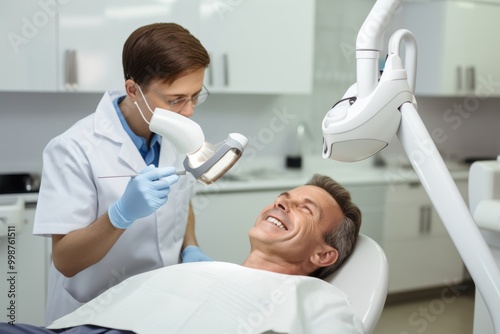 A man is in a dental chair as a dentist checks his teeth