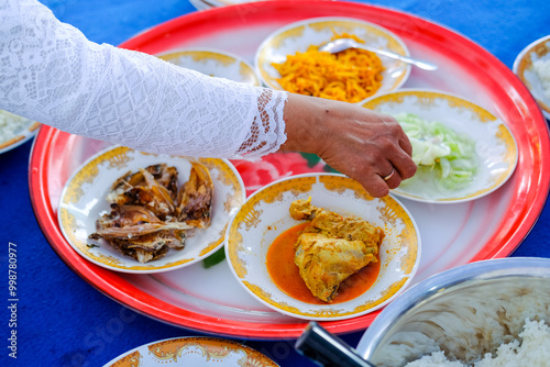 Saprahan is a tradition of eating together in Malay community customs which is carried out by sitting cross-legged in groups. This tradition is an intangible cultural heritage recognized by the state. photo