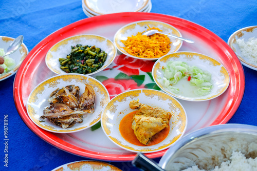 Saprahan is a tradition of eating together in Malay community customs which is carried out by sitting cross-legged in groups. This tradition is an intangible cultural heritage recognized by the state. photo