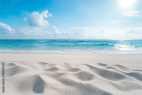 A picturesque tropical beach with clear blue waters and white sandy shores under a bright, sunlit sky.
