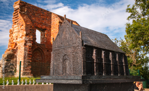 sculpture and ruins of a church in Trzęsacz, Poland. photo