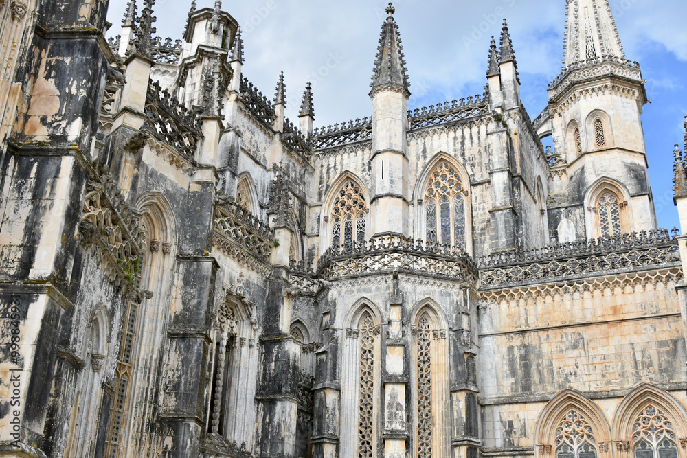 Fototapeta premium Gothic and Manueline Exterior of Batalha Monastery near Entrance to Unfinished Chapels, Portugal