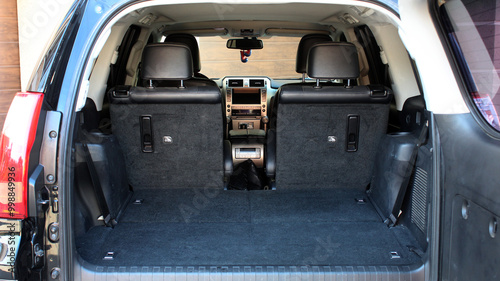 Trunk luxury car. Modern wagon car open trunk. Car boot is open. The car boot is open for luggage. A lot of space for coffers and bags. Ready for trip.