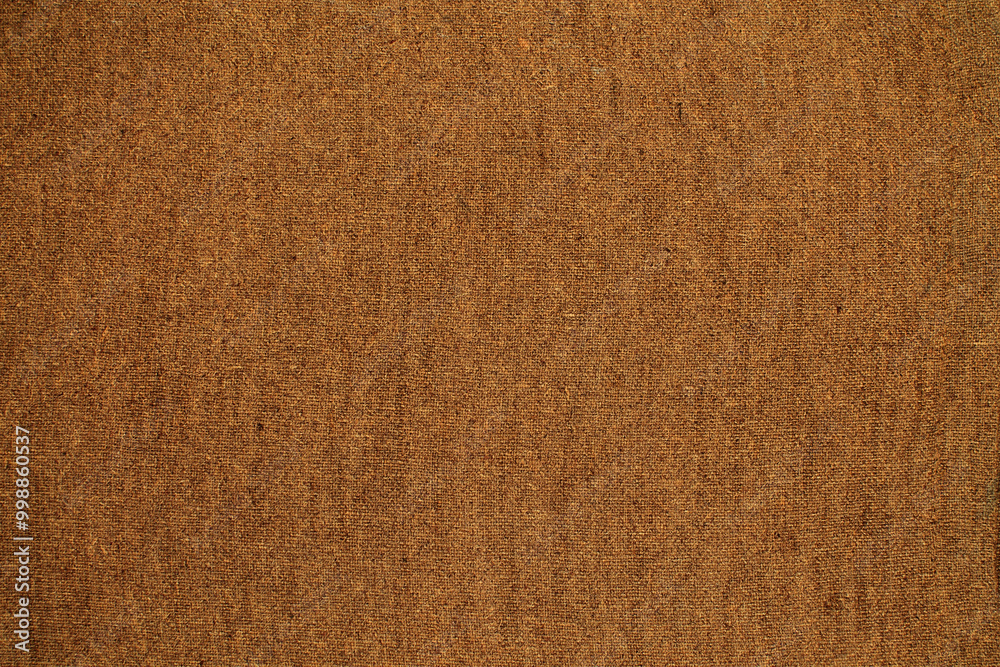 Fototapeta premium Natural Linen Material Textile Canvas Fabric Texture Background Close-up Detail of Fabric Natural Color Hemp Material Pattern Design Wallpaper. Can be Used as Background or For Graphic Design