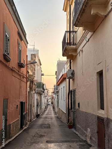 Fototapeta Naklejka Na Ścianę i Meble -  A narrow street in an ancient Italian town