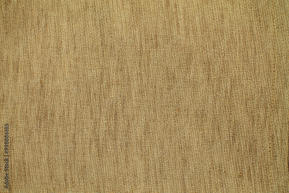 Fototapeta premium Natural Linen Material Textile Canvas Fabric Texture Background Close-up Detail of Fabric Natural Color Hemp Material Pattern Design Wallpaper. Can be Used as Background or For Graphic Design