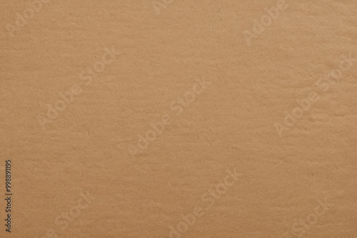 Brown craft paper texture with natural grain and rough surface. For backgrounds, eco-friendly designs, packaging mockups, handmade products, environmentally conscious branding, rustic elements