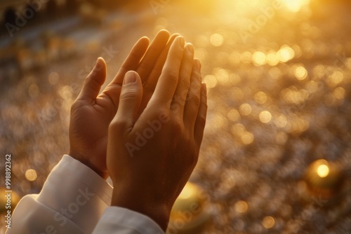 Hands Raised In Prayer At Sunset During Sacred Pilgrimage Reflecting Devotion And Faith