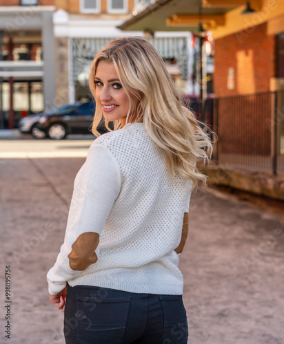 Blonde Beauty Strolls Through Town, Savoring the Crisp Air and Colors of a Perfect Autumn Day