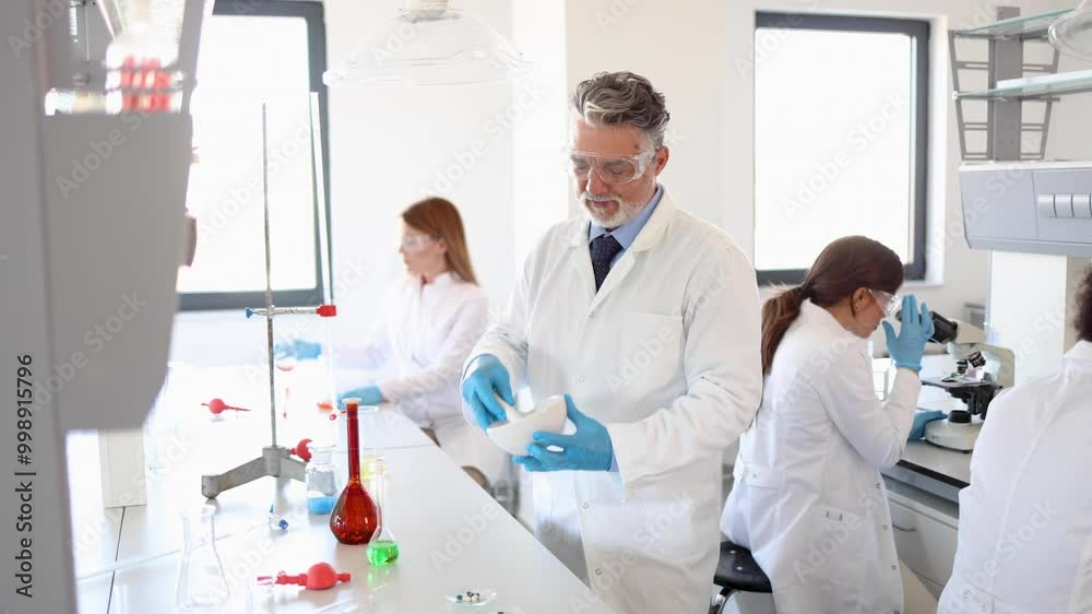 Scientist examining some chemicals Scientist examining some chemicals