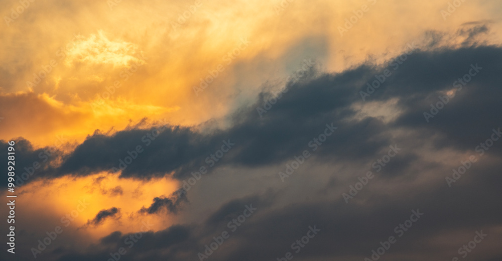 Sky background. Bright evening sunset sky with dramatic clouds. Sky background. Bright evening sunset sky with dramatic clouds.