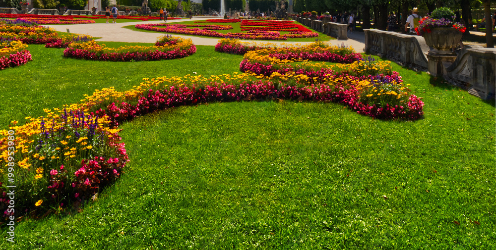 Getting down to enjoy the baroque floral arrangement, Salzburg, Austria Getting down to enjoy the baroque floral arrangement, Salzburg, Austria