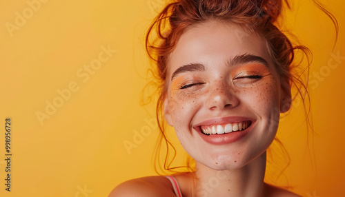 Fashion, young millennial woman smiling, bold makeup, copy space, natural beauty, bright yellow and pink colors background wallpaper backdrop.