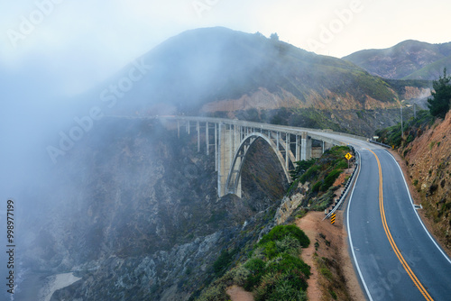 Beautiful scenery of Pacific Ocean coast along Highway 1 and Big Sur, wonderful aerial view of Bixby Bridge, sunset, sunrise, fog. Concept, travel, vacation, weekend