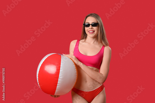 Young woman in swimsuit wit...