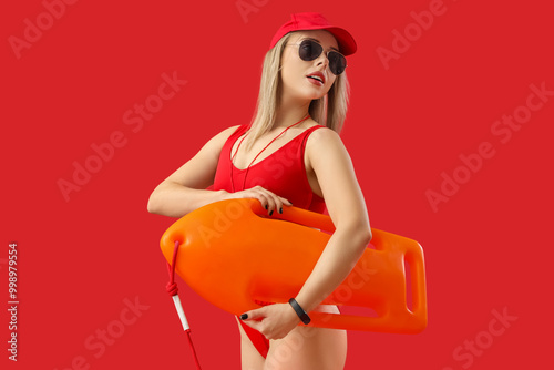 Female lifeguard with rescu...