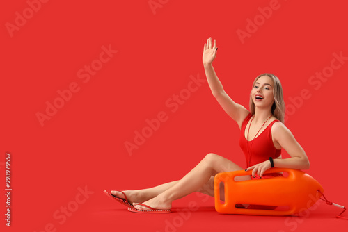 Female lifeguard with rescu...